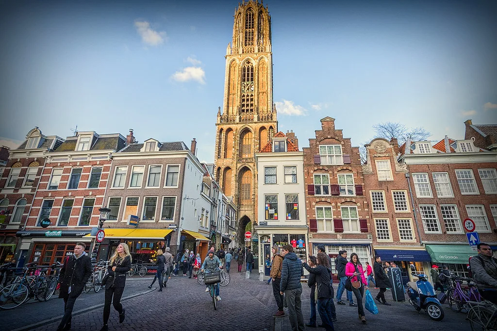 The Dom Tower above a busy street in Utrecht.