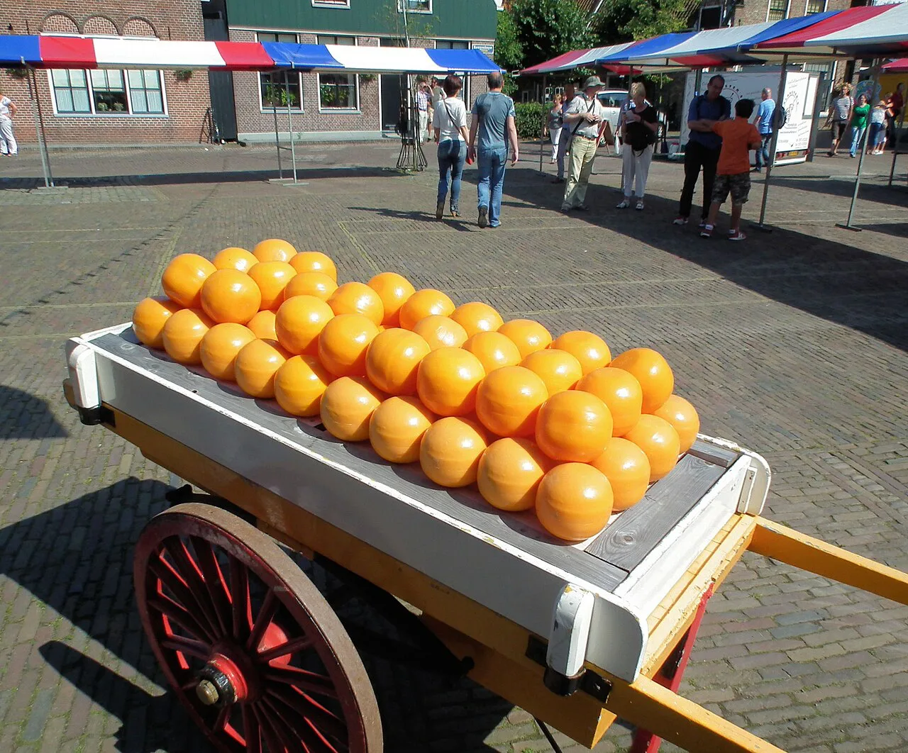 A cart of cheeses at the Edam cheese market.
