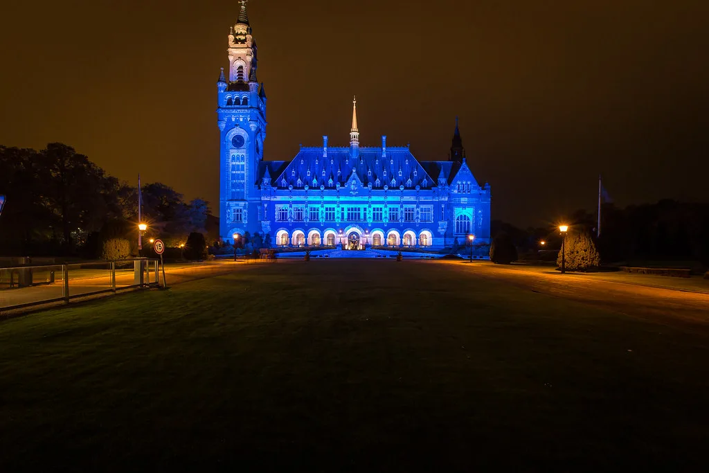 The Peace Palace lit blue at night, The Hague.