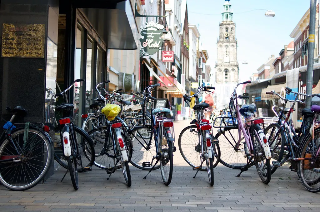 Bicycles in a street below the Martinitoren, Groningen.