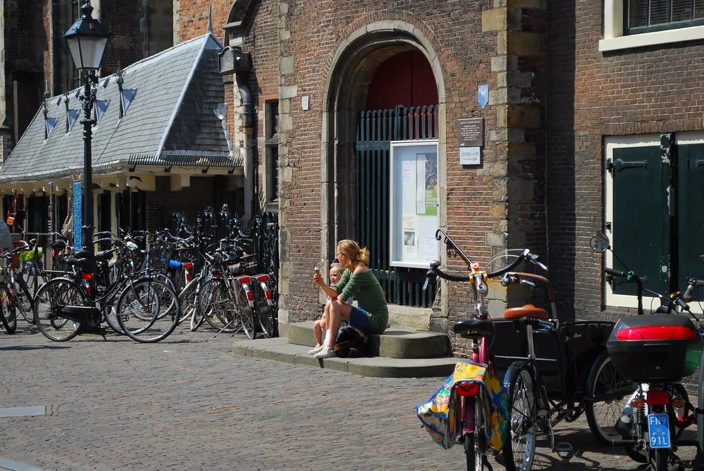 Bicycles by a historic building in central Haarlem.