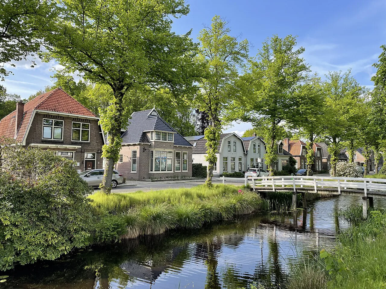 A canal and bridge in a Dutch village in May.