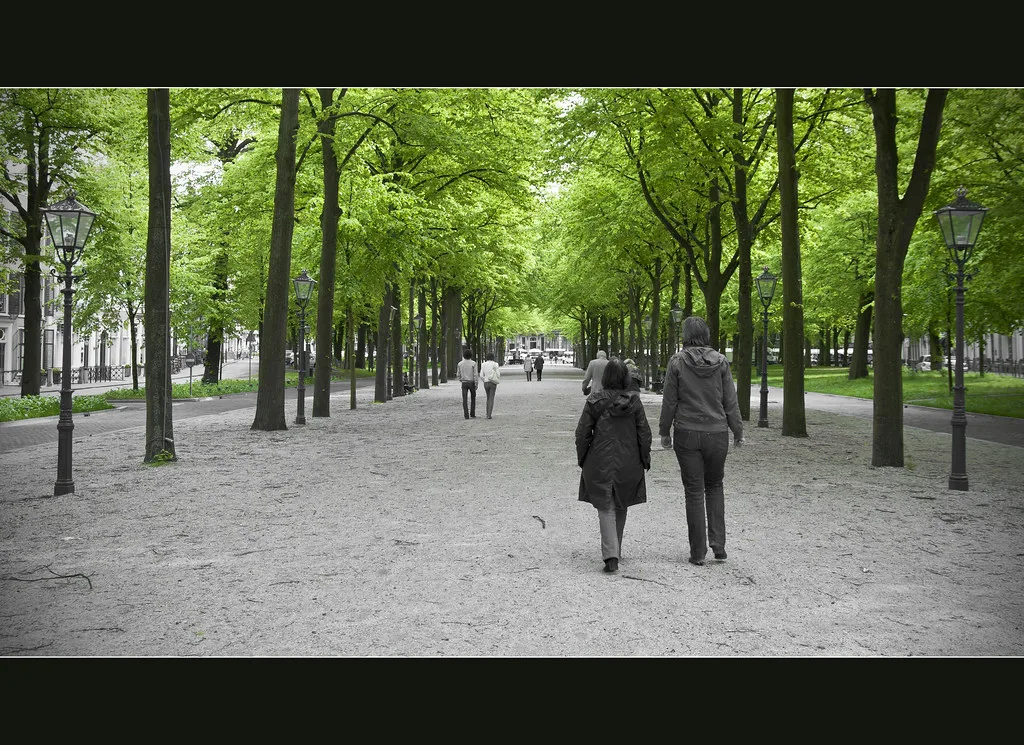 A couple walking on the Lange Voorhout, The Hague.