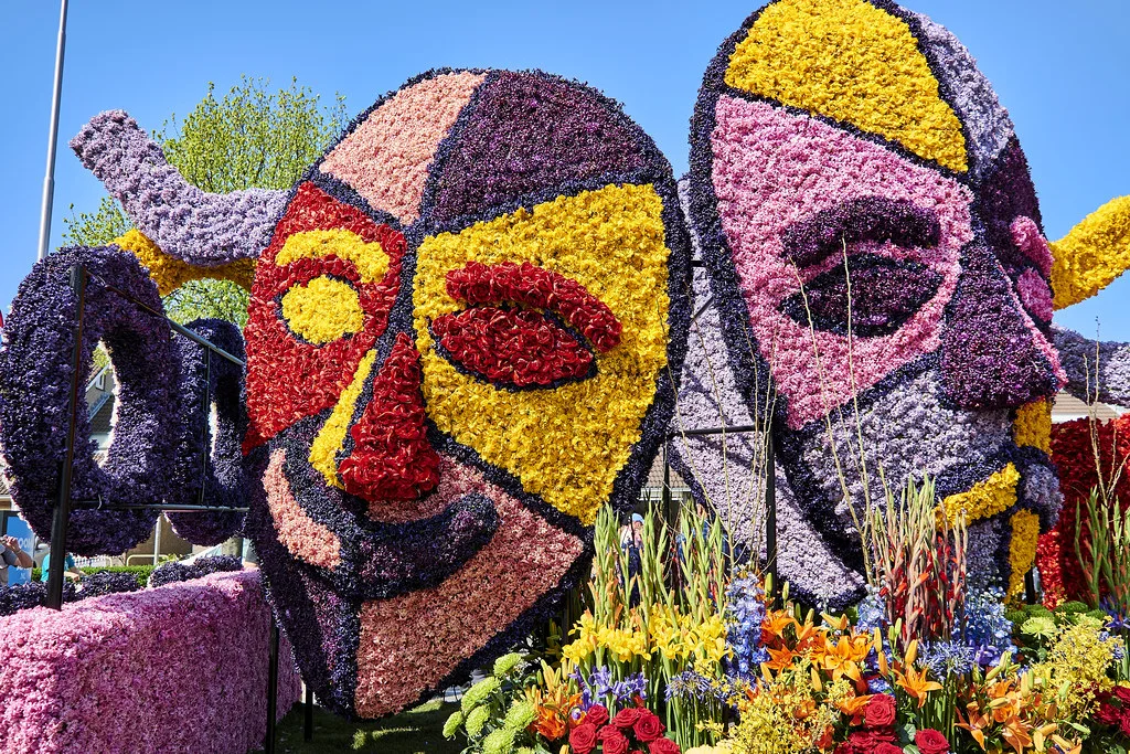 Masks made of flowers in a Bloemencorso parade.